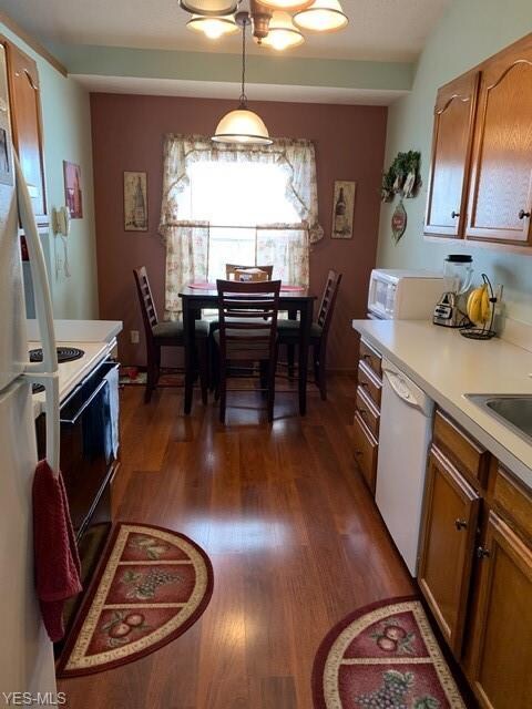 Newer flooring in the eat in kitchen. 16' x 8'