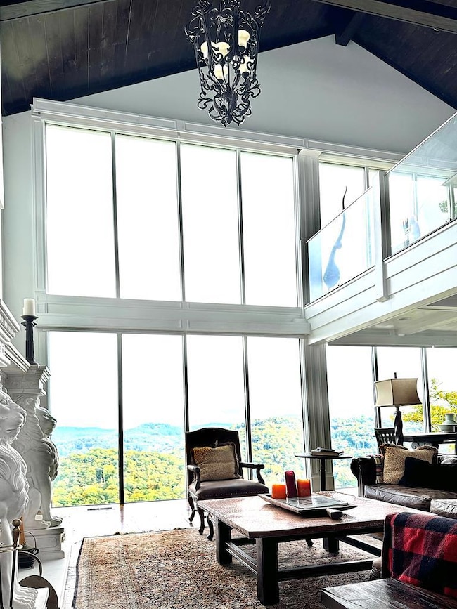 The wall of windows overlooks Lake Glenville. Cust