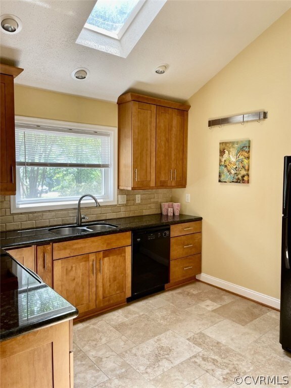 Kitchen has travertine tile floor, granite counter