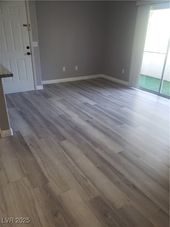 Unfurnished room featuring plenty of natural light