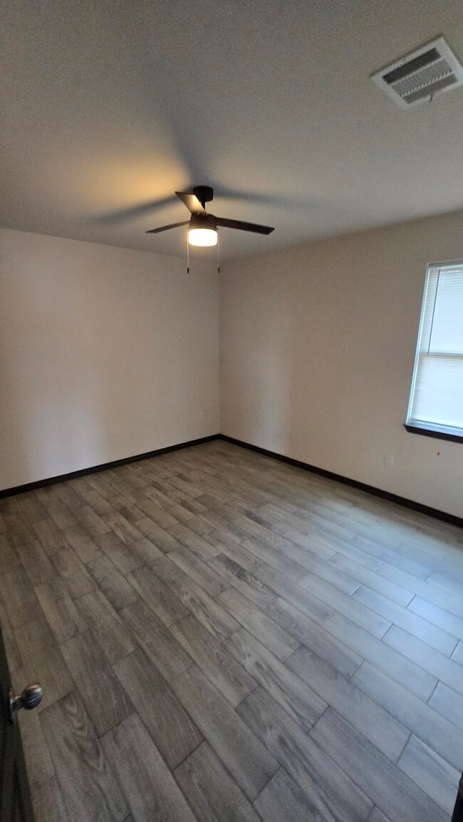 
Bedroom 2, no carpet, offering a bright and spaci