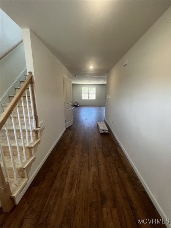 Foyer with stairway and dark wood finished floors