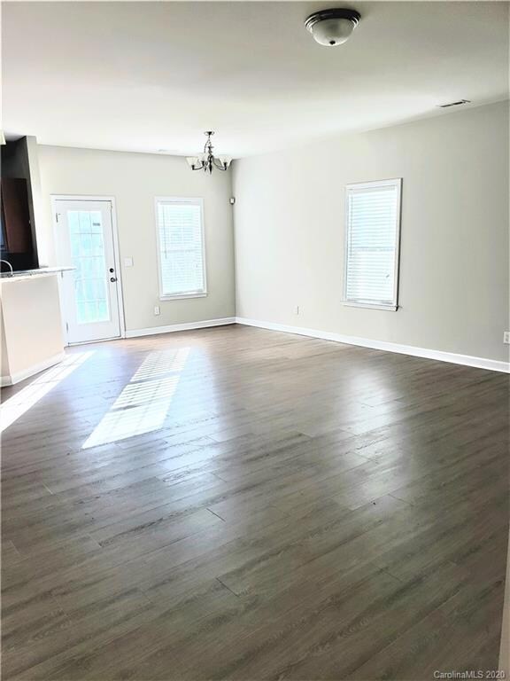 Large great room plus the dining area. Door leads to backyard.