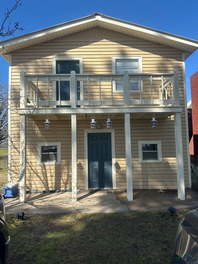 front of house featuring a balcony
