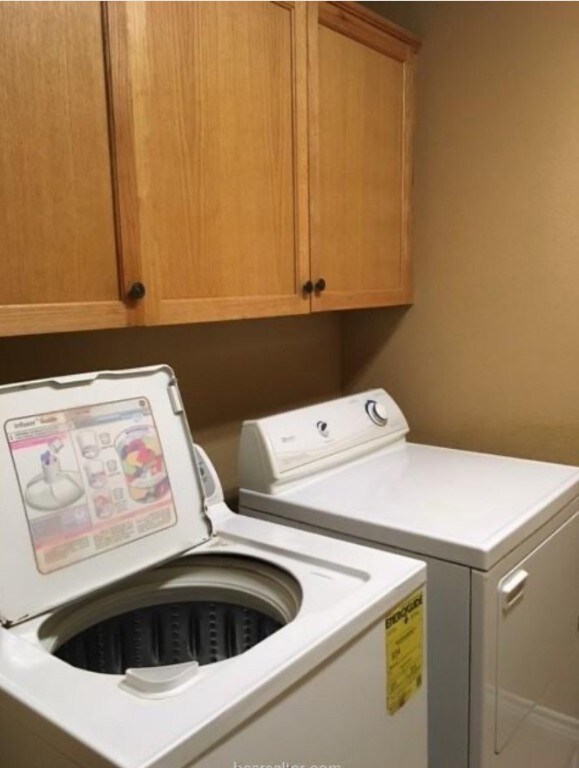 Laundry area featuring washer and clothes dryer an
