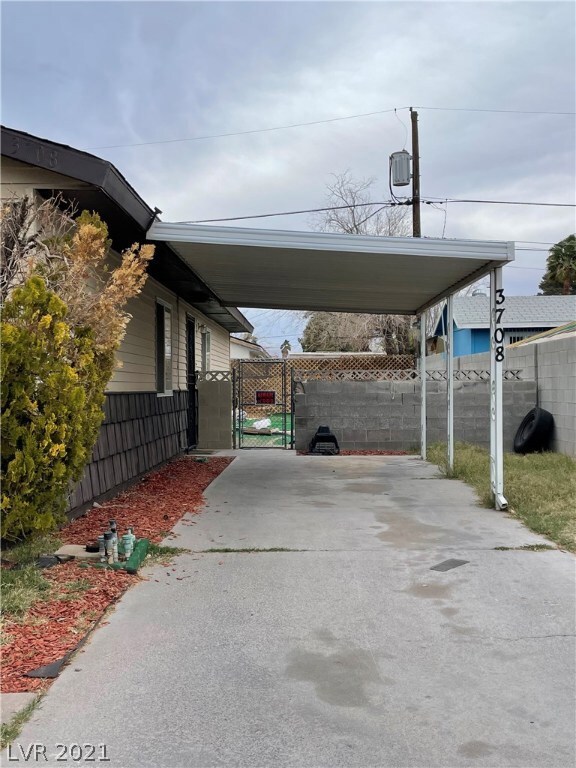 Tandem style carport covers one car, can easily fi