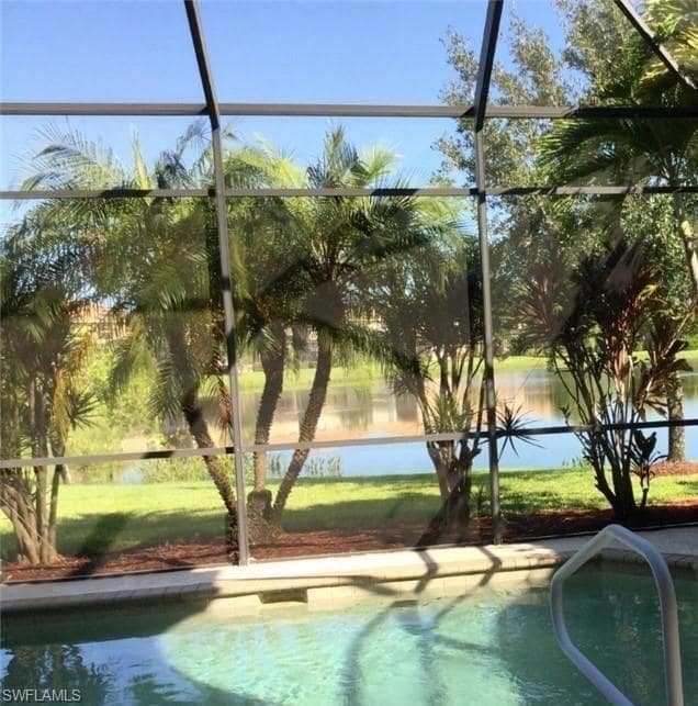 Outdoor pool featuring a lanai