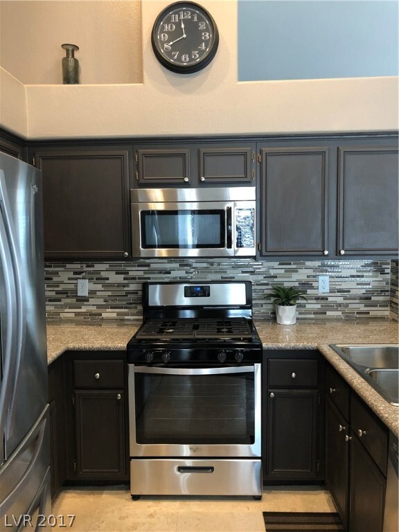KITCHEN VIEW OF GAS COOK TOP AND OVEN AND BEAUTIFU
