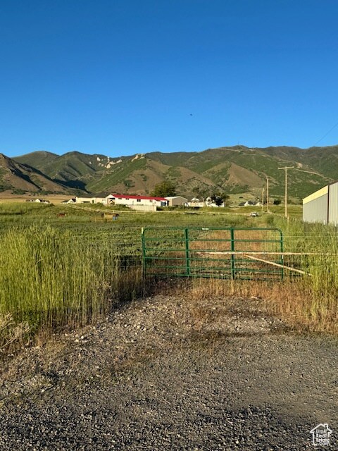 View of mountain backdrop with rural landscape