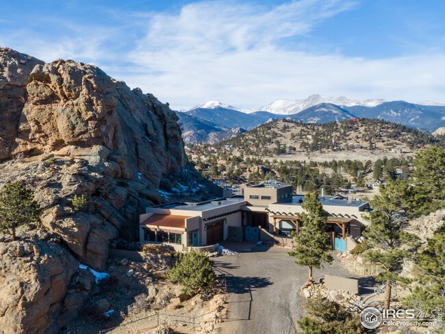 Tucked against Sheep Rock with Divide Views