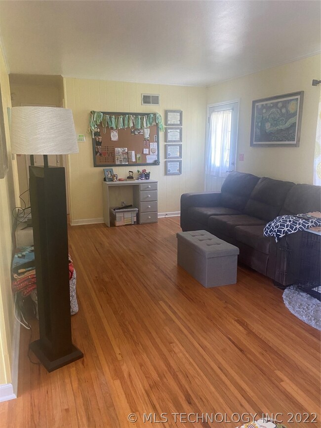 LIVING AREA WITH BEAUTIFUL ORIGINAL HARDWOODS