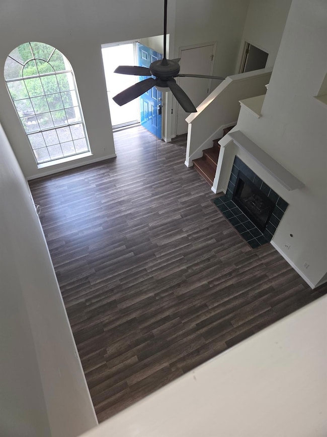Unfurnished living room featuring dark wood-style