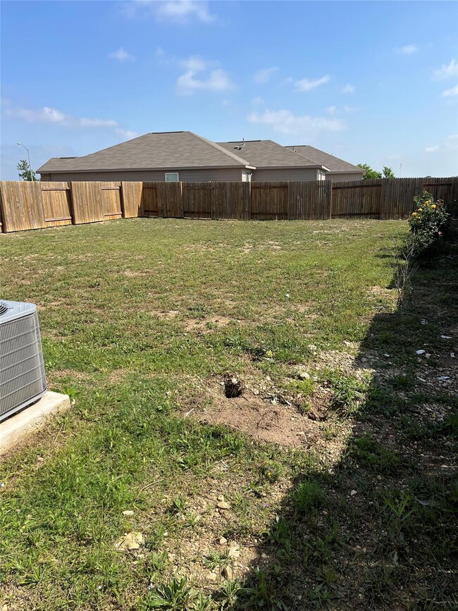 View of yard with central air condition unit and 