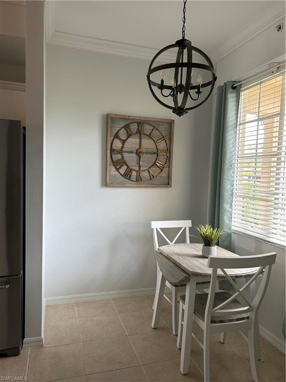 Tiled dining area featuring a healthy amount of su