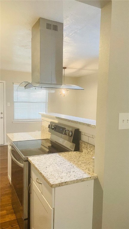 Kitchen featuring stainless steel range with elect