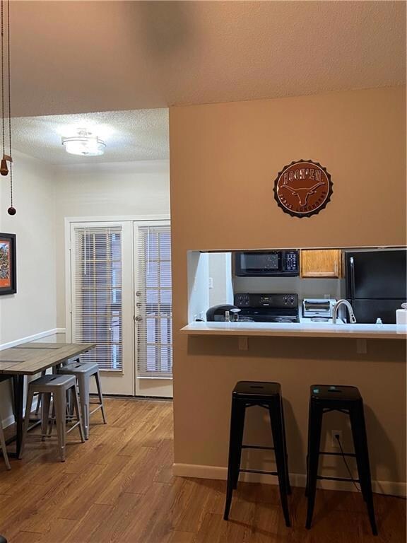 Kitchen featuring built in microwave, freestandin