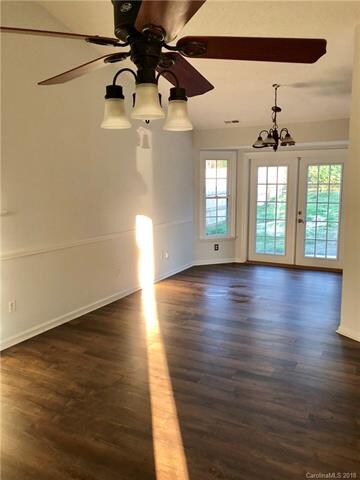 expansive GR w volume ceilings, new wood laminate 