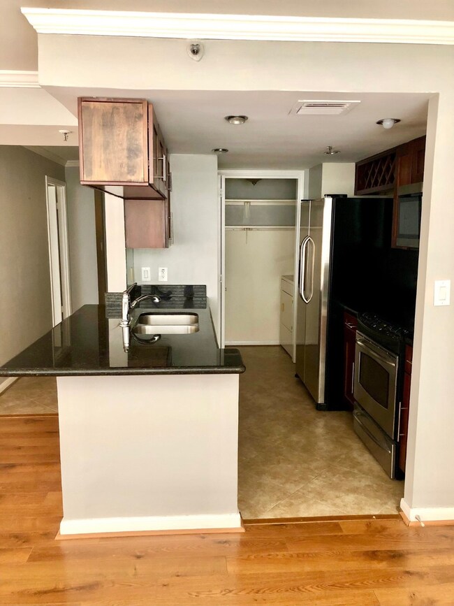 Stainless steel appliances with a ceramic cooktop.