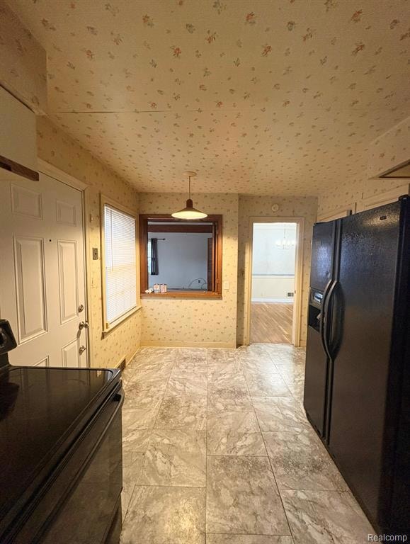 Hallway with wallpapered walls