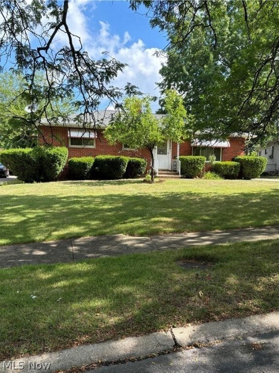 View of front of house with a front lawn