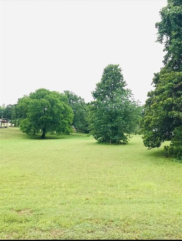 View of green lawn featuring a rural view