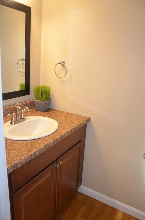 Modern vanity with updated fixtures in the half ba