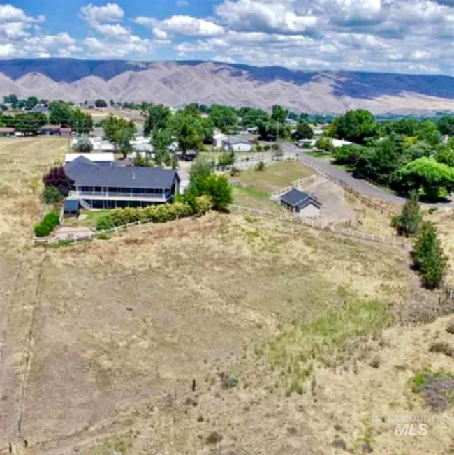 Drone / aerial view of back of property and acreage