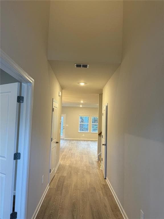 Hall featuring light wood-style floors