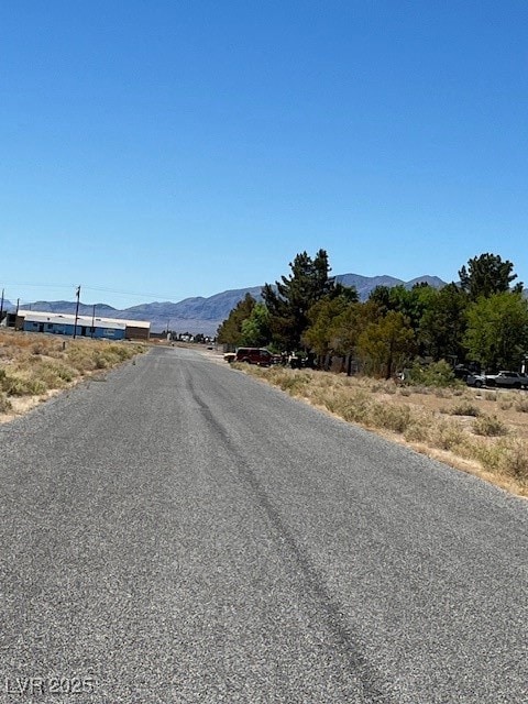View of asphalt street with a mountain view