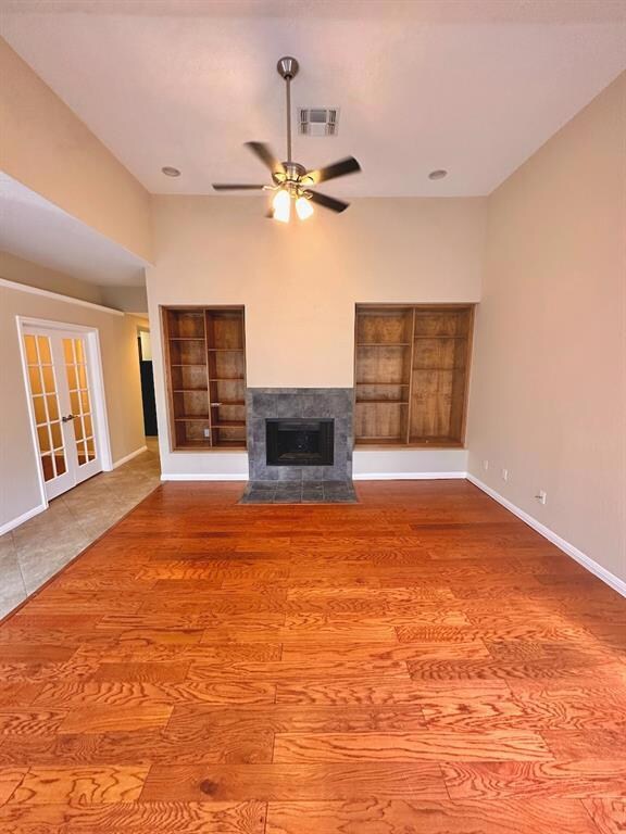 Unfurnished living room with wood finished floors