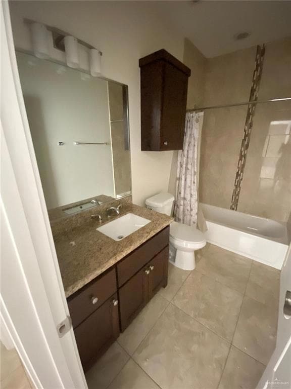 Bathroom with vanity, shower / bath combo, and tile patterned floors