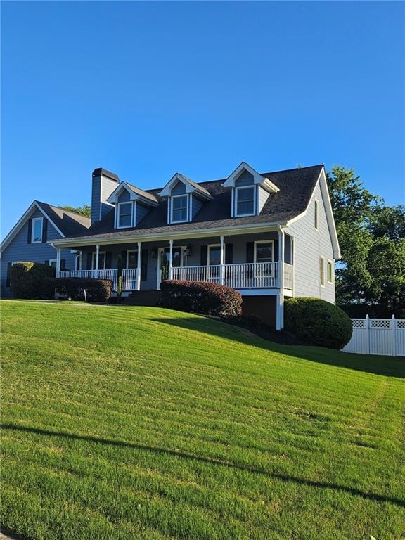 Cape cod-style house with a porch