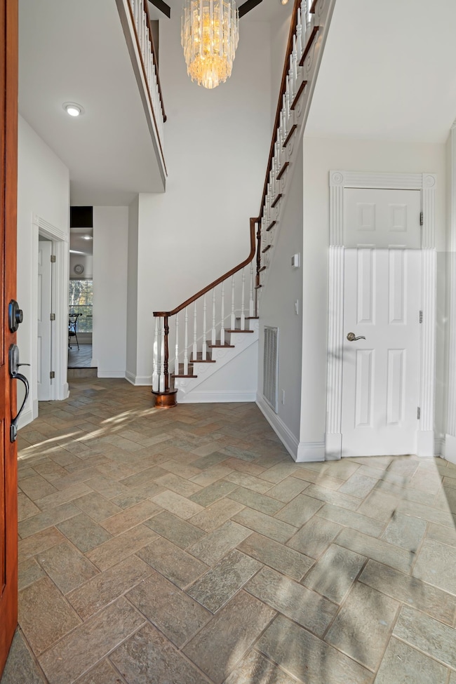 Welcome into 101 Governors Point. The door on the right is a closet. The door on the left is the renovated half bathroom.