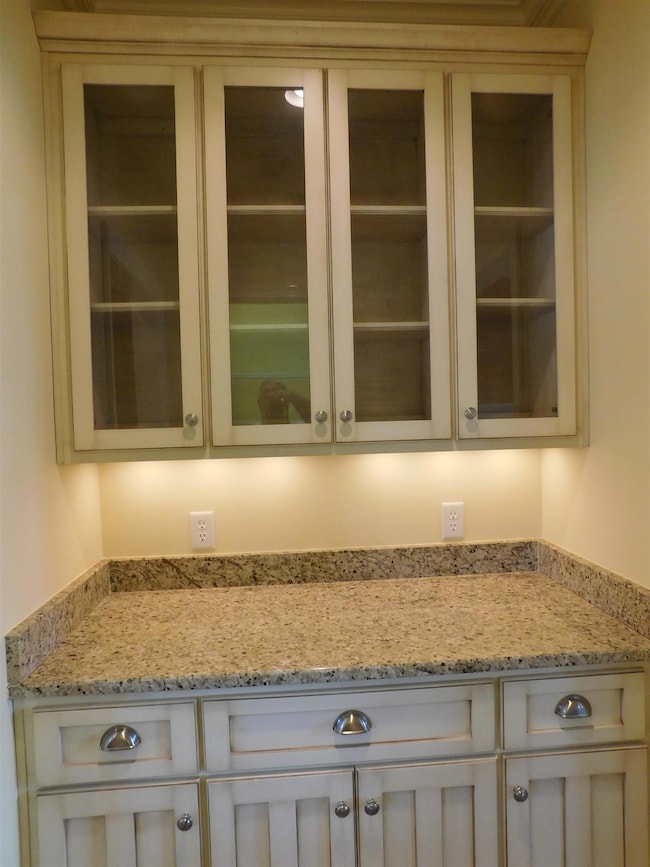 You'll love this butler's pantry with granite and custom cabinetry. 