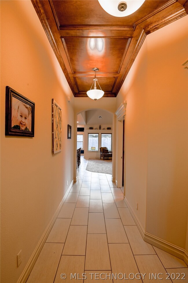 Grand entry with wood accent ceiling