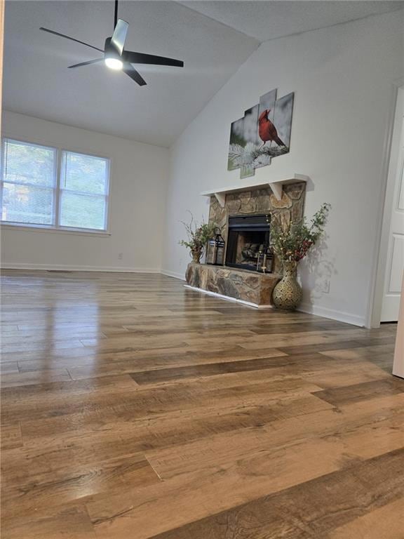 Unfurnished living room with a fireplace, wood fin