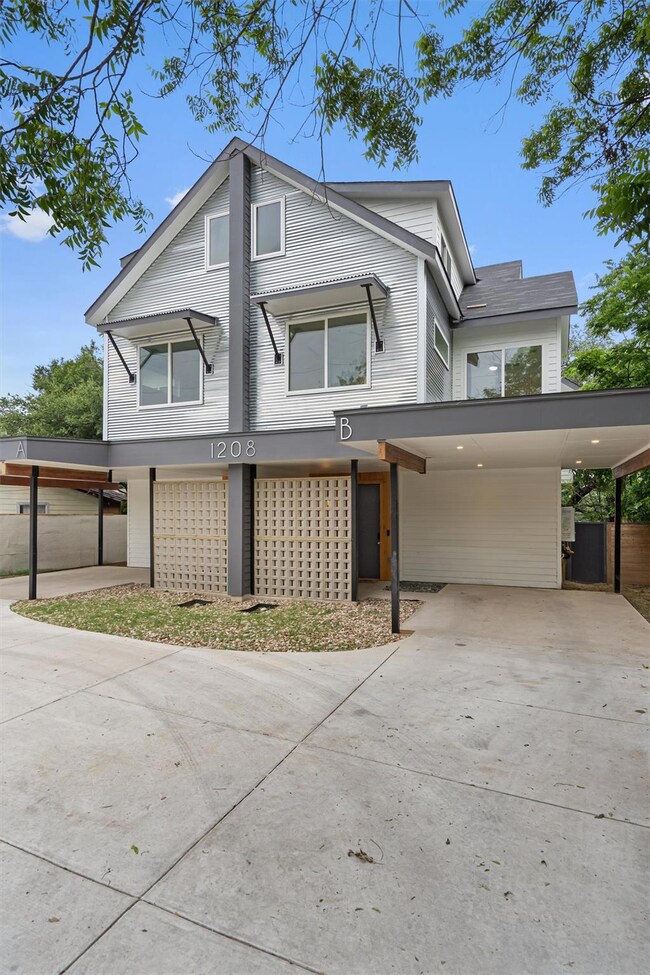 View of front facade featuring concrete driveway 