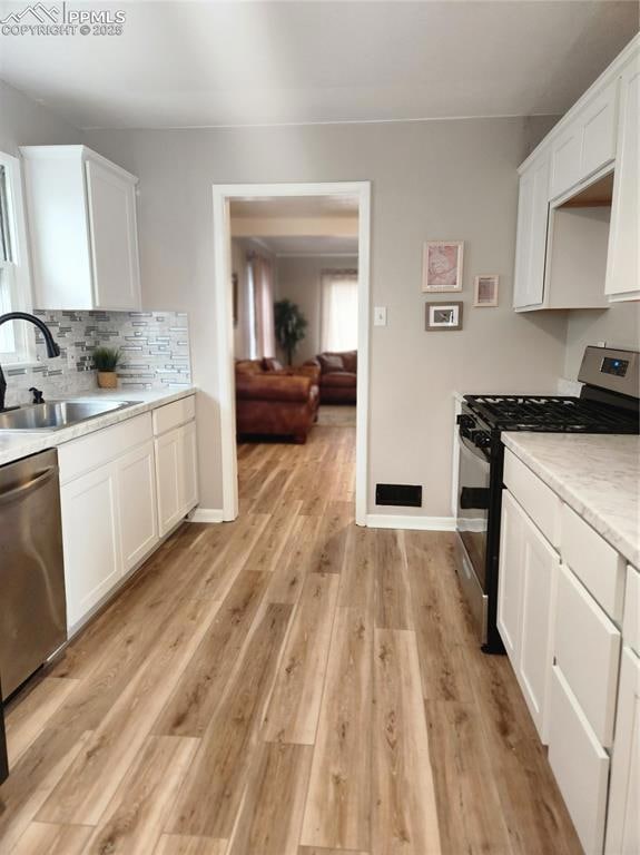 Kitchen featuring light countertops, dishwashing m