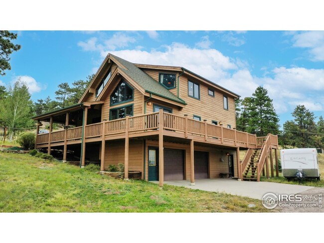 Wrap-around deck for year-round enjoyment. Even room for your small RV!