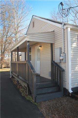 Covered side entrance leading to kitchen. Carport just beyond!