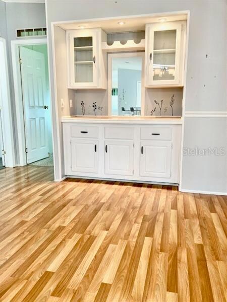 Built-in sideboard with cabinets adjacent to the kitchen