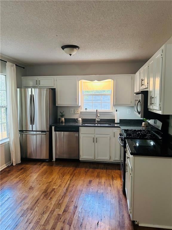 Kitchen with dark countertops, a healthy amount of