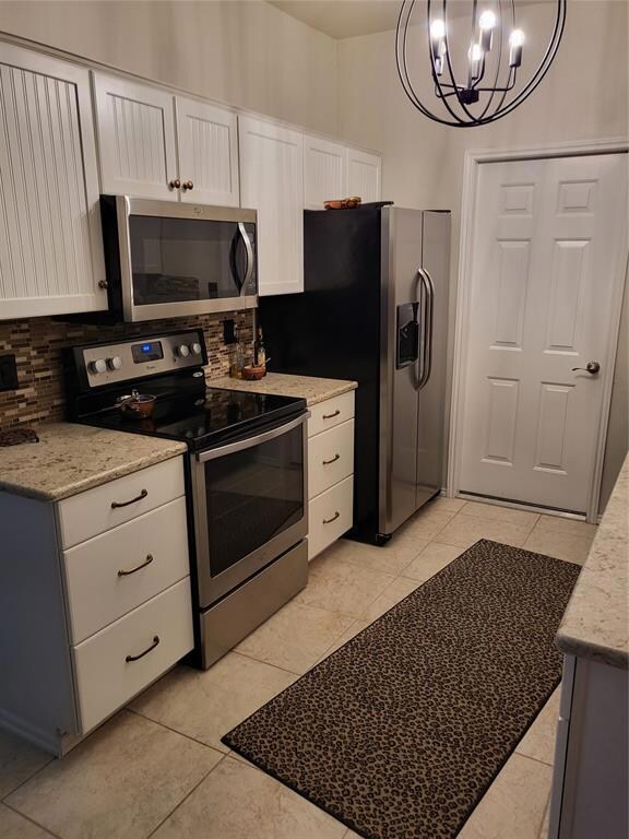 Kitchen featuring decorative light fixtures, quart