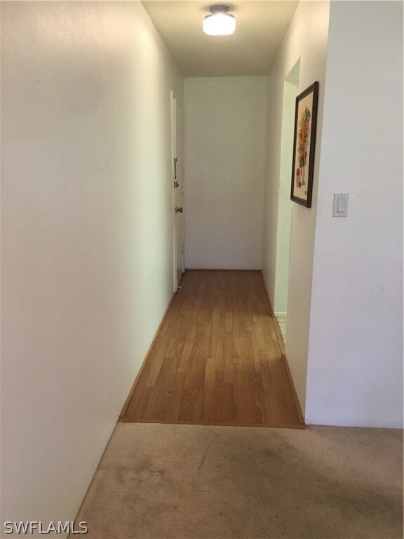 Entry door to the left, kitchen entry on the right