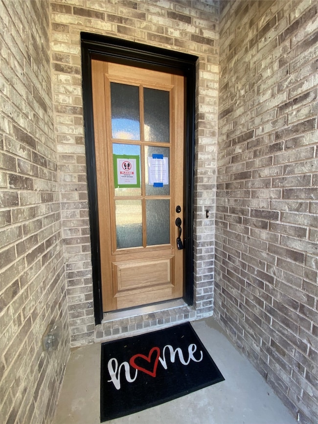 Welcoming front entry with impressive 8 ft iron & glass front door (not stained yet.)