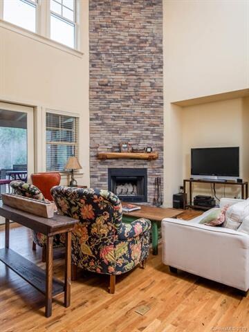 Cathedral ceiling & stacked stone wood-burning fir