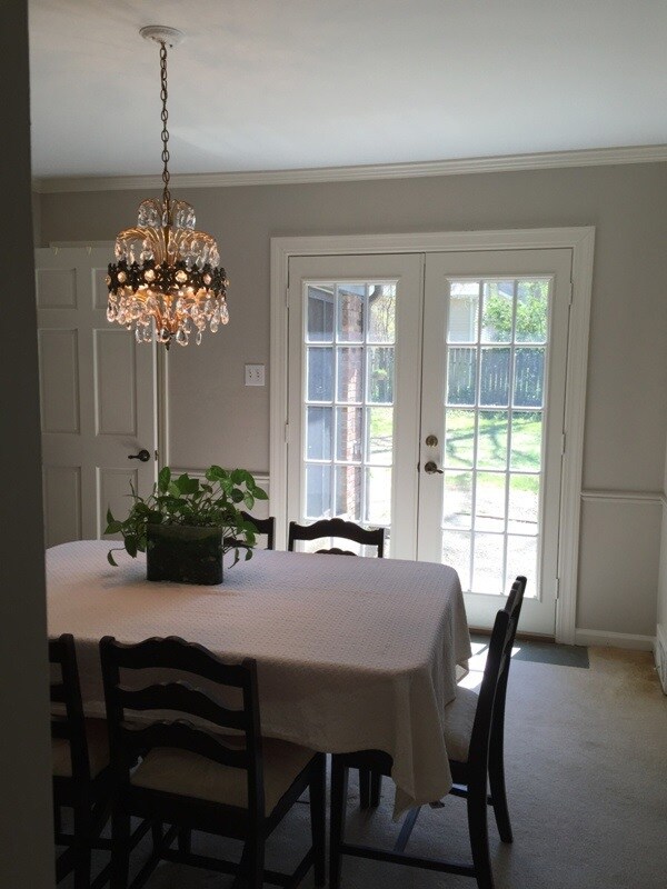 Dining room with exterior doors onto patio.