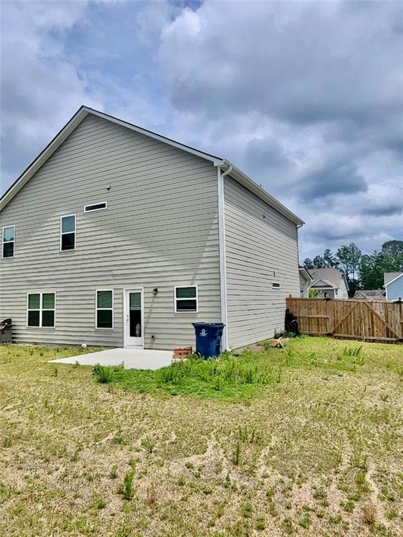 Back of house with a patio