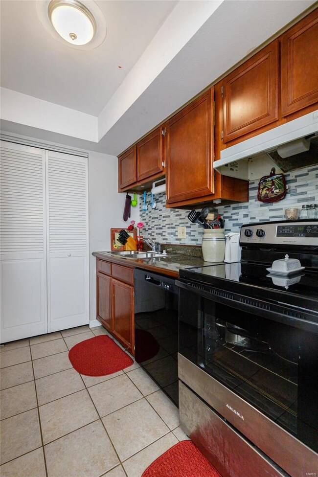 The kitchen has a new dishwasher and range.