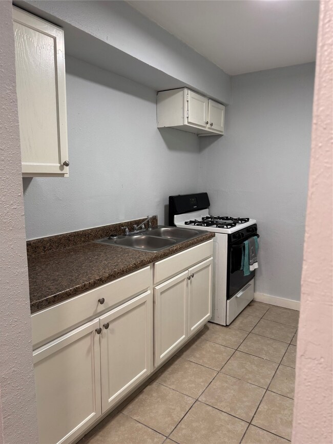 Efficient kitchen with a gas stove and ample count